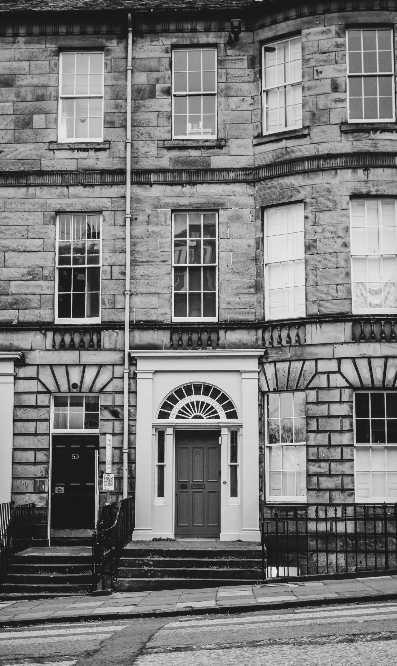 Stone Edinburgh facade with sash windows and a doorway