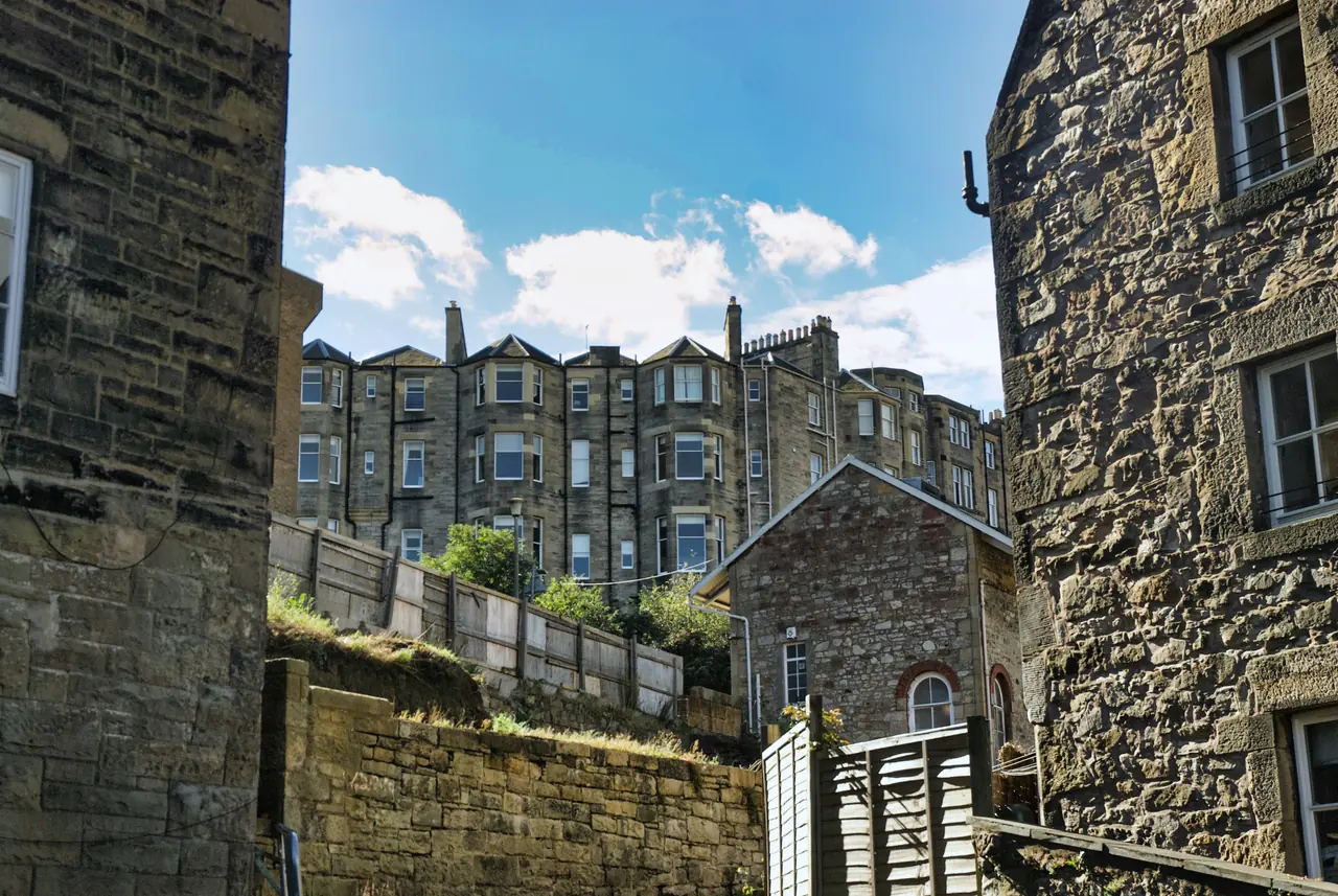 Stone buildings in Edinburgh under blue sky